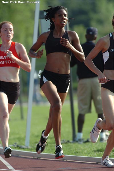 Amonica Phipps, representing the Gladiator Track Club, runs among a pack of four.