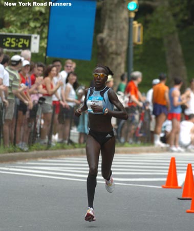 Lornah Kiplagat runs past the five-mile mark and the second place runner is still out of sight.