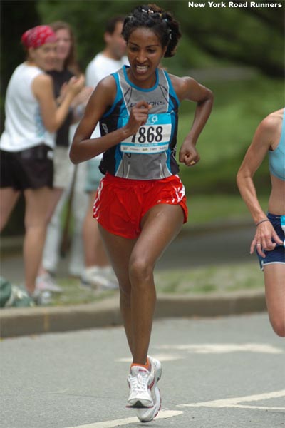 Alemtsehay Misganaw of the Westchester Track Club (16th, 35:52) works to hold off Emily Richard.