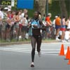 Lornah Kiplagat runs past the five-mile mark and the second place runner is still out of sight.