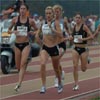 Jenelle Deatherage (left) and Carrie Tollefson took over the pacing duties on the first lap and the rest of the field stayed close behind.