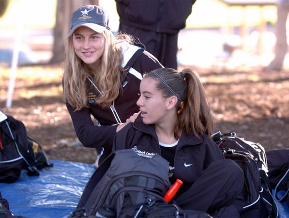 Honorary team captain Lauren Fleshman gives Kauren Tarver a pre-race massage.