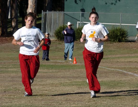 Nicole Blood (left) warms up with her teammate Caitlin Lane.