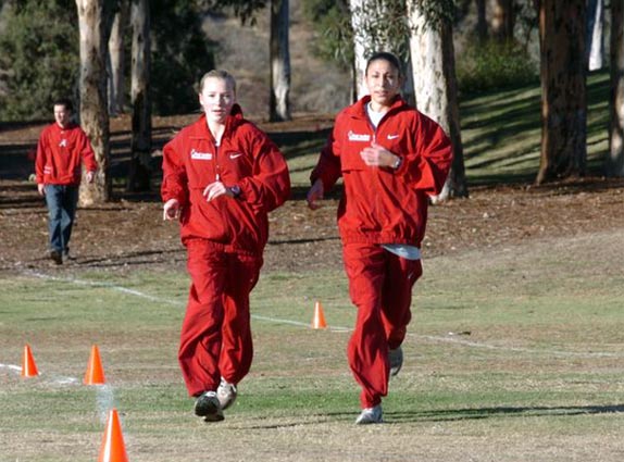 Briana Jackucewicz (left) warms upu with her Northeast teammate and fellow New Jersey native Danielle Tauro.