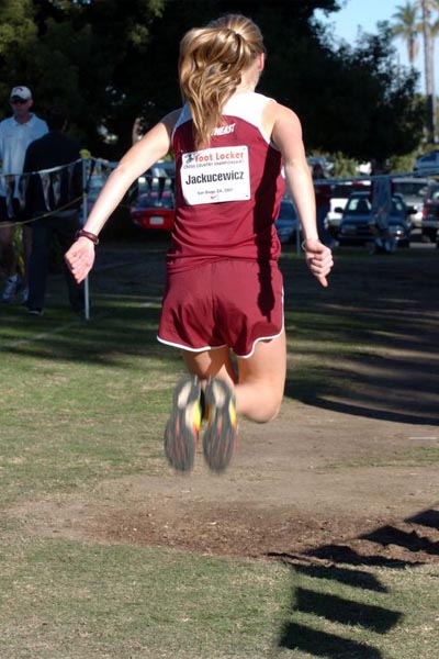 Briana Jakucewicz does some strides and drills to warm up.