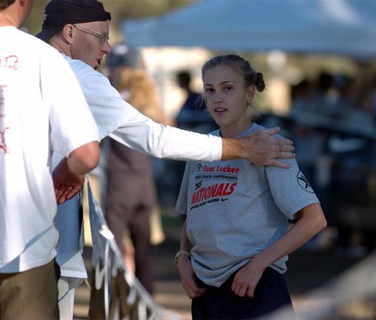 Midwest winner Keara Sammons talks to her coach, Greg Weich.