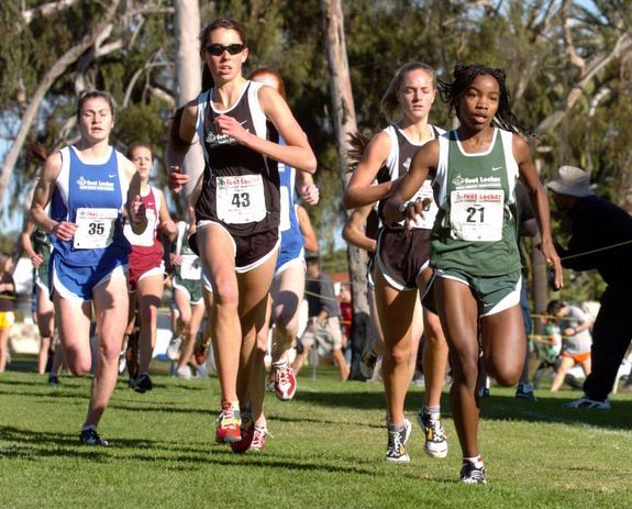 Megan O'Reilly (#43) and Nichole Jones (#21) lead a group of runners.