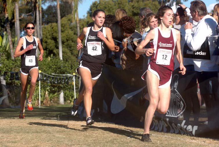 Marie Lawrence runs in third place.