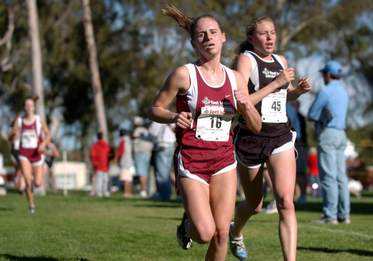 Liz Costello (left, 21st, 18:09) and Crystal Reed (24th, 18:14) with less than two tenths of a mile to go.