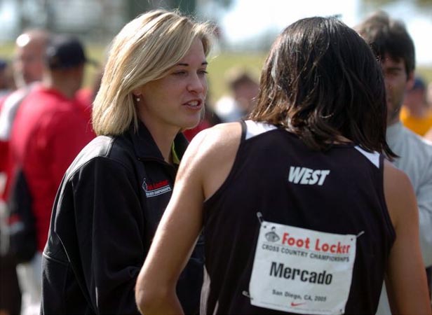 Suzy Favor Hamilton talks to one of the male athletes after the race.