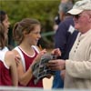 Nicole Blood signs an autograph.