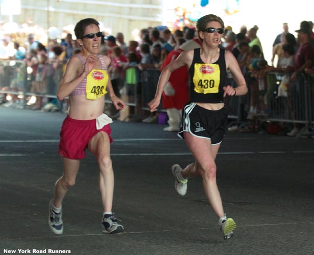 Ann Hird (left, age 46) and Karen Mohr (age 40) battle to the finish.