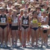 The professional runners stand at the front of a sea of women.