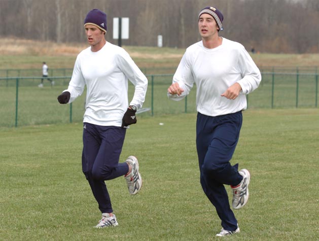 Tim Moore (left) and a Notre Dame teammate.