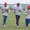 Runners from South Alabama, TCU, and Eastern Kentucky (if their sweats are to be believed) run the course together.