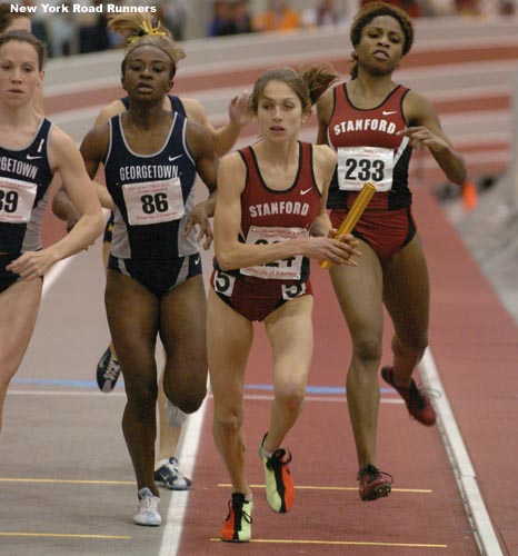 With UNC still out in front, Stanfords Chinny Offor hands off to teammate Sara Bei, and Michigan and Georgetown are also right there.