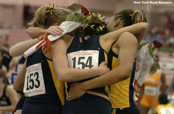 The four Michigan runners embrace.