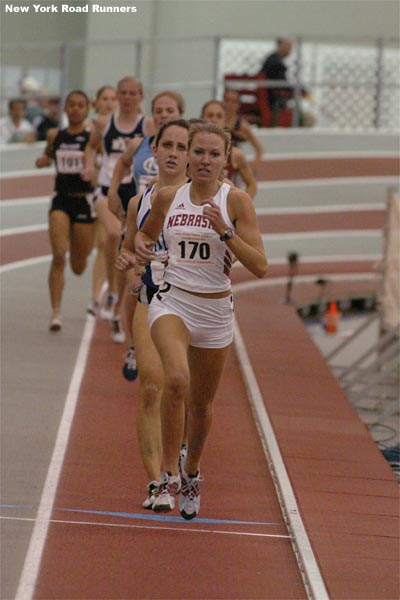 With one lap to go, Anne Shadle was still in control of the pace, but Shannon Rowbury was right behind her...