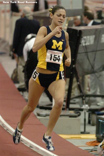 Lindsey Gallo runs hard with one lap to go in the mile final at the 2005 NCAA Indoor T&F Championships.