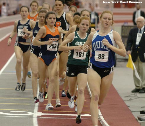UNC-Charlotte's Cassie Ficken (#181) runs in second place and Adriana Pirtea (#259) runs in about fourth.