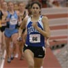 Dukes Meaghan Leon continues to lead by a significant margin on the 1,200-meter leadoff leg.