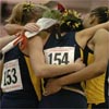 The four Michigan runners embrace.