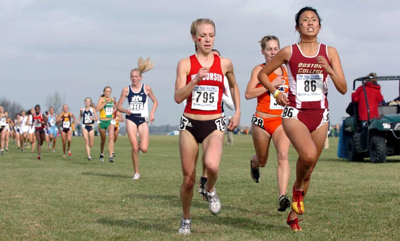 Wisconsin's Katrina Rundhaug (left, 36th, 20:29.9) and BC's Laurel Burdick (35th, 20:29.9) lead Illinois' Stephanie Simms (37th, 20:30.4).