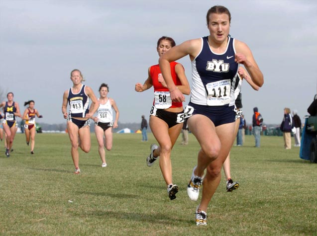 BYU's Anne Heiner (139th, 21:26.2) leads Arkansas' Kelly Vrshek (140th, 21:27.4).