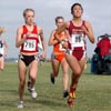 Wisconsin's Katrina Rundhaug (left, 36th, 20:29.9) and BC's Laurel Burdick (35th, 20:29.9) lead Illinois' Stephanie Simms (37th, 20:30.4).