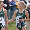 Katie Kelly (right) talks to Michigan State teammate Michelle Rafferty.