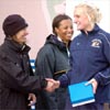 Winner Johanna Nilsson shakes hands with former NCAA great Caroline Zajac-Tynan (who was known as Carole Zajac when she was in the NCAA).