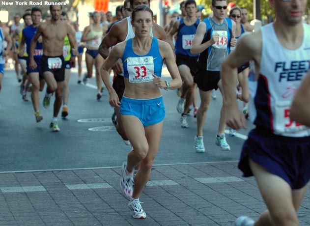 Nicole Aish of Gunnison, Colorado, runs close behind Russell.