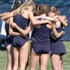 The Notre Dame team stands in a huddle before the race.