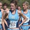 UNC's Megan Kaltenbach (with teammate and sister Katelyn Kaltenbach on the left and another teammate, Brianna Felnagle on the right.