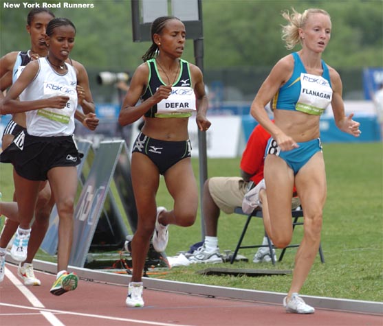 Shalane Flanagan (at right) ran an aggressive race from the start, she ran right behind the rabbit through the first two laps, ahead of Meseret Defar and Werknesh Kidane.