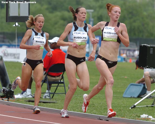 R-L: Katie McGregor, Amy Rudolph, and Jen Rhines follow Tadesse.