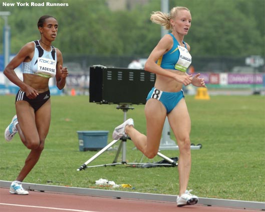 Shalane Flanagan moves into third place, ahead of Tadesse, with just under three laps to go.