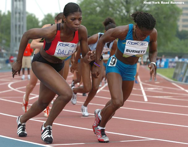 Pacesetter Ronetta Smith and Marian Burnett react to the starting gun.