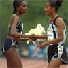 Tirunesh Dibaba (left) congratulates Sentayehu Ejigu, who finished third in 15:09.07.