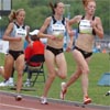 R-L: Katie McGregor, Amy Rudolph, and Jen Rhines follow Tadesse.