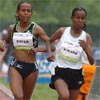 With two laps to go, Werknesh Kidane continues to lead Meseret Defar.