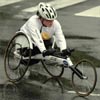 A wheelchair competitor makes the turn onto the Harvard Bridge to head back over into Boston. (Must of the race is run in Cambridge.)