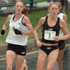 Marie Davenport (right) and Katie McGregor run shoulder to shoulder with Ethiopia's Aster Demissie in third.