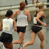 Marie Davenport and Katie McGregor lead the way over the bridge.