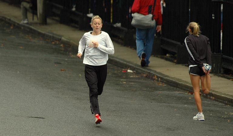 Marie Davenport warms up before the race. Rain fell steadily in the hour before the race, but by the time the race started...