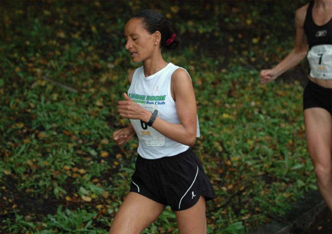 Aster Demissie of Ethiopia heads around a relatively sharp turn just before the mile mark.