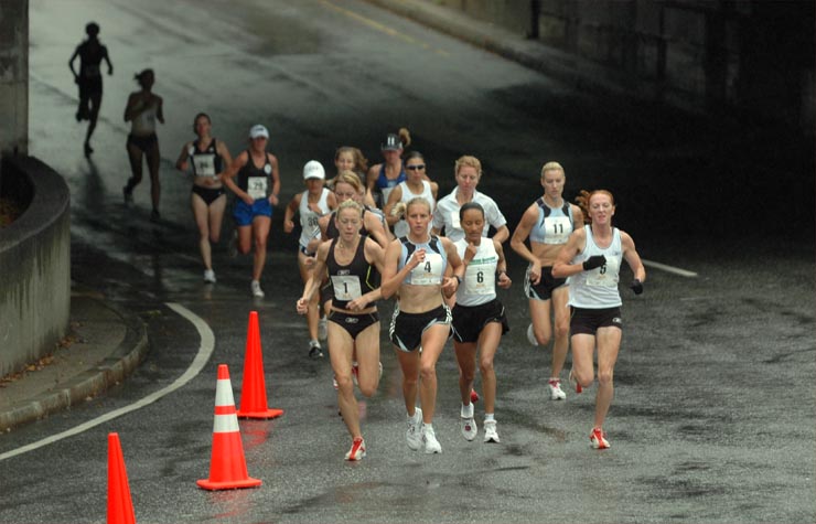 L-R: Marie Davenport, Amy Yoder-Begley, Aster Demissie, and Katie McGregor lead the way approaching the mile mark.