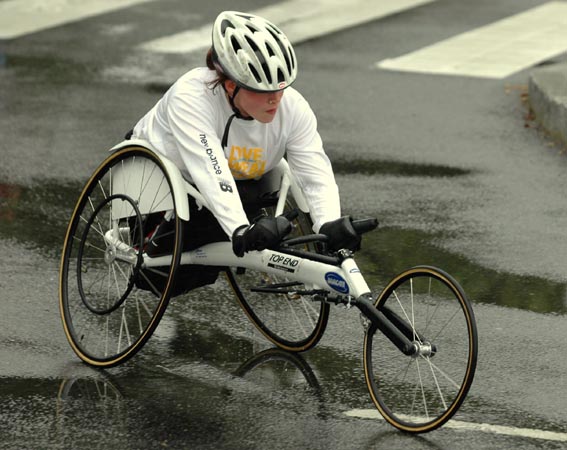 A wheelchair competitor makes the turn onto the Harvard Bridge to head back over into Boston. (Must of the race is run in Cambridge.)