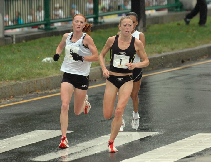 Marie Davenport (right) and Katie McGregor run shoulder to shoulder with Ethiopia's Aster Demissie in third.