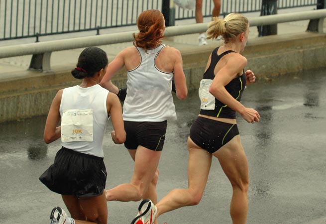 Marie Davenport and Katie McGregor lead the way over the bridge.